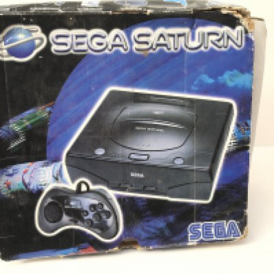 A boxed SEGA SATURN console. Includes controller and cables. No reserve