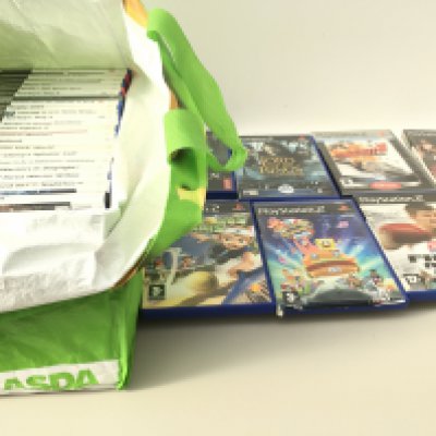 A bag containing in excess of 30 boxed PlayStation 2 games. No reserve