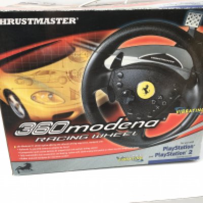 A boxed Thrustmaster 360modena Racing wheel. Use with PlayStation 2. No reserve