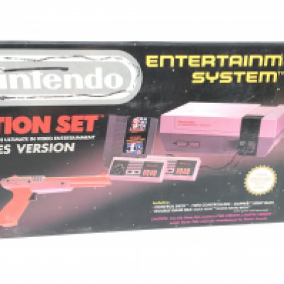 A boxed Nintendo Entertainment System. Action Set. Includes controllers..gun..cables..manual. No reserve