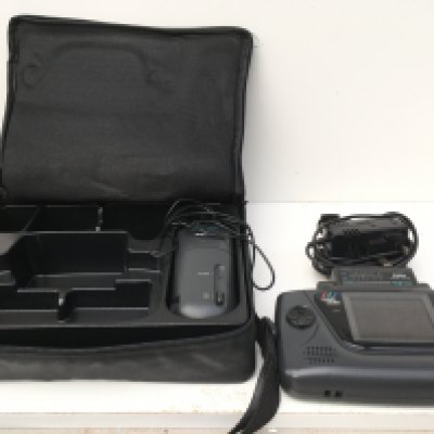 A Sega Game Gear includes hold-all..batterpack..AC power supply..TV tuner and hand stap. No reserve