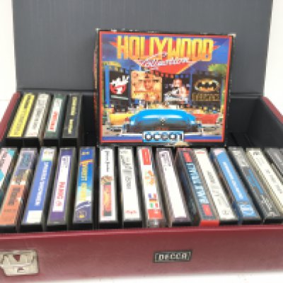 A collection of boxed game cassette tapes for Commodore 64. Includes storage case. No reserve