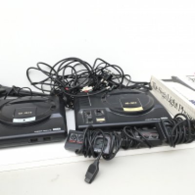 2x SEGA Mega Drive consoles includes control pads..cables ..2 light phasers (1 boxed). No reserve
