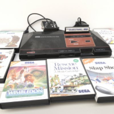 A SEGA Master System including power supply..controller and 8 games cartridges. No reserve