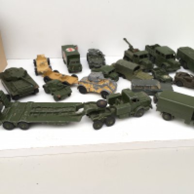 A collection in excess of 15 Playworn military themed diecast vehicles. Manufacturers include Primarily Dinky but some others. No reserve