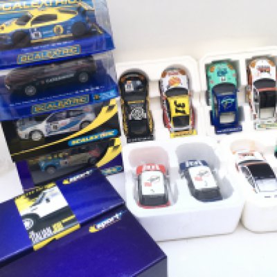 A Collection of Boxed Scalextric Cars. 14 in total