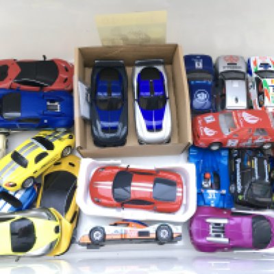 A Box Containing A Collection Of Scalextric Cars.
