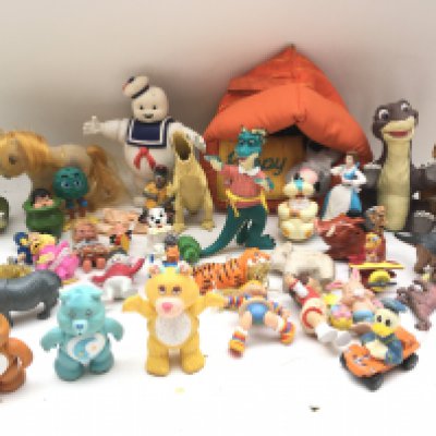 A Collection of Various Toys and Figures includes Care bears.