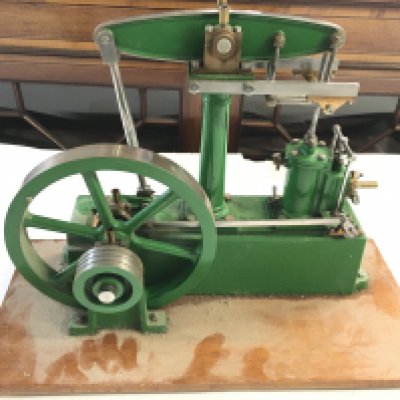 A Stuart Steam Plant With 7 inch Flywheel On A Wooden Plinth.