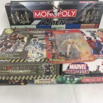A collection ofSuperhero games and figures some unused others with additional playing pieces. No reserve