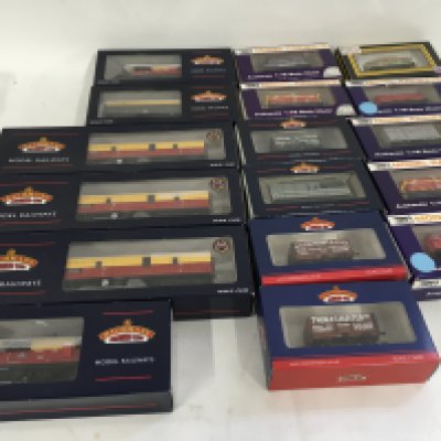 A collection of boxed 00 gauge model railway coaches and wagons by Bachmann and Dapol . No reserve