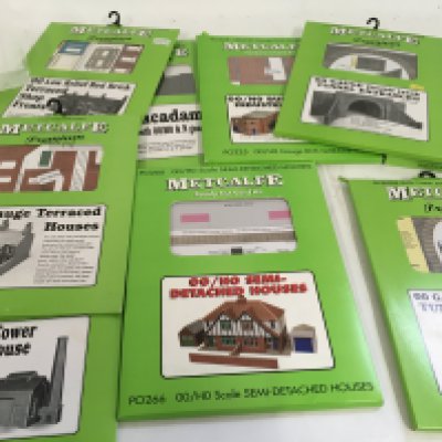 A collection in excess of 30 packs of Metcalfe printed Ready cut Card kits for creating scenery. Some have been opened but many remain sealed. 00 gauge. No reserve