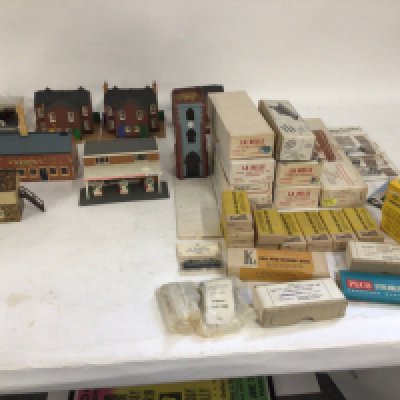 A mixed collection of model railway pieces, including buildings, kits to build wagons ..coaches and locomotives mostly N gauge. No reserve
