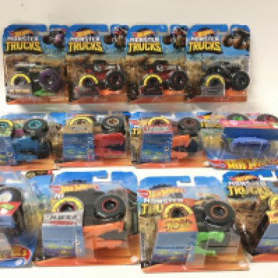 A collection of 12 Hot Wheels Monster Trucks 1:64 scale. Includes All Fried Up..Zombie Wrex..plus others. No reserve