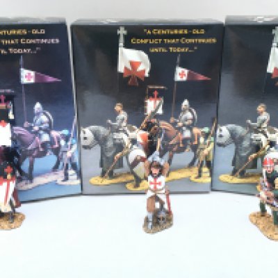 3 X Boxed King And Country Crusaders. A Crossbowman Loading. A Charging Knight And Standing Knight With Flag And Shield.