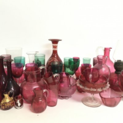 A collection of Victorian Cranberry and green glass including an oil lamp, vases etc. This lot cannot be posted