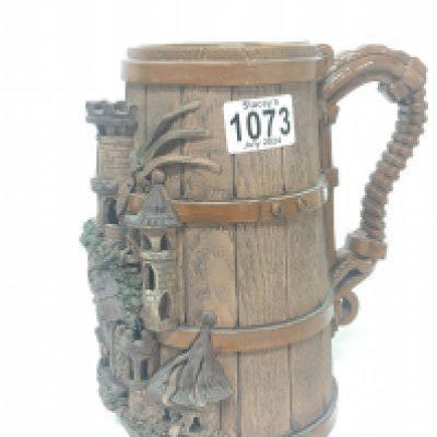 An unusual German pottery tankard with raised Castle tower decoration marks to the base Height 22cm