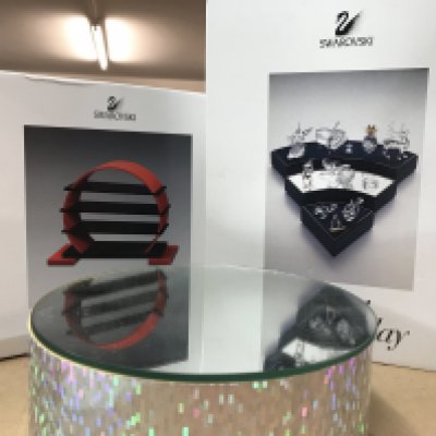 Three Swarovski display stands including stepped and revolving (not seen working). NO RESERVE