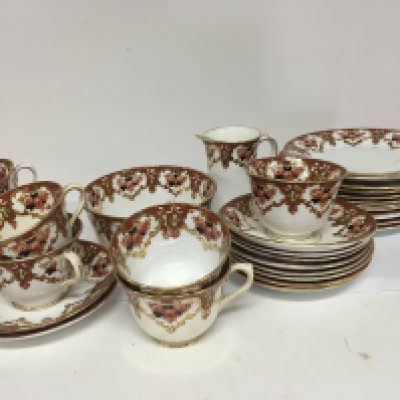 A Royal Albert early 20th Century tea set. decorated with flowers and gilt.