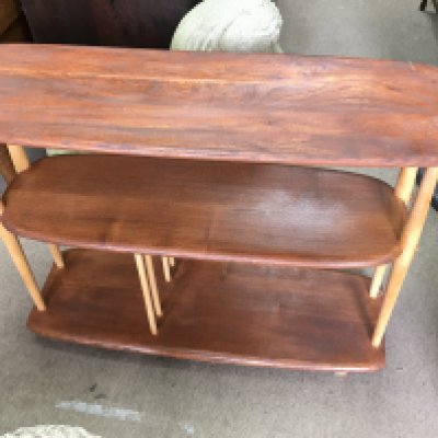 A wooden side or drinks multi level table on wheels. 90cm wide 69cm tall 32cm deep. Postage D