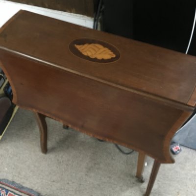 An Edwardian inlaid drop leaf mahogany table