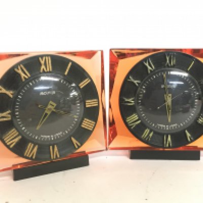 A pair of Russian Molnija mid 20th century clocks. One Seen working