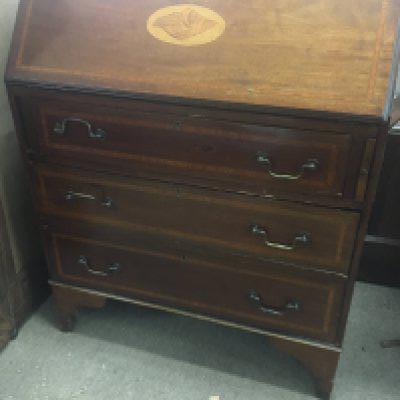 An Edwardian inlaid Mahogany bureau with a well fitted interior above three drawers.