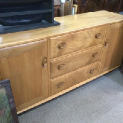 An Ercol sideboard, approx 155cm x 68cm x 45cm. Shipping category D