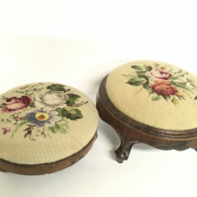 A pair of foot cushions with floral embroidered cushion designs. Postage category c