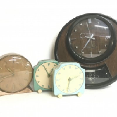 Vintage clocks including a Coramatic Transistor wall clock, a Smiths mantel clock and two APL clocks