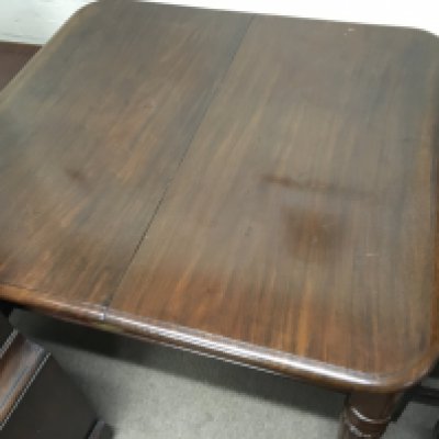 A Victorian mahogany dining table with matching chairs