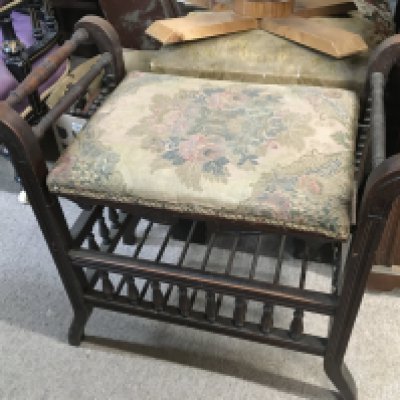A late 19th century adjustable piano stool, 60cm wide 60cm tall.