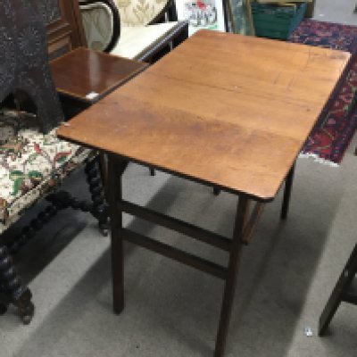 A folding mahogany work table 75cm wide, 69cm tall.