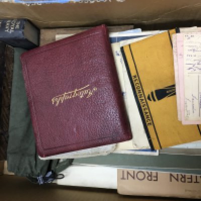 An assortment of WW1 & WW2 books and other documents including bomb resistance armband and german letters. This lot cannot be posted