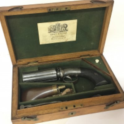 A Quality early 19th Century English Peperpot Revolver six shot with engraved steel action maker John Boston of Wakefield 1827-1857. With engraved and numbers barrels Bro Boston. In an original oak vase with makers label and with accessories mechanism working fine and in extremely good condition.