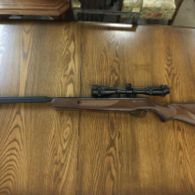 A Stoeger X20 S2 air rifle with a 3-9x40AO scope . Cal.5.5mm/.22 STG1850498. With accessories and a rabbit shooting target.