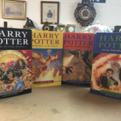 Four Harry Potter hardback books including The Order of The Phoenix