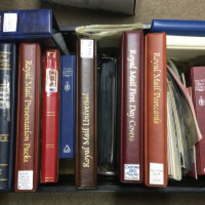 A collection of albums containing first day covers, stamps, post cards etc