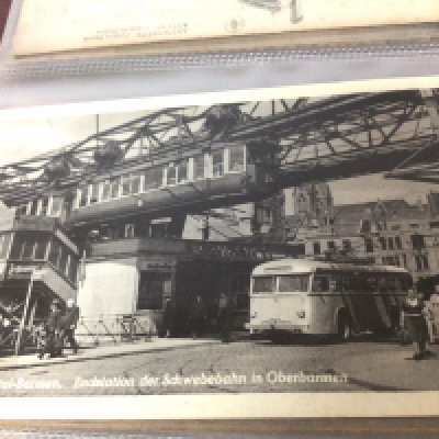 An album containing postcards and bank notes including European cards.