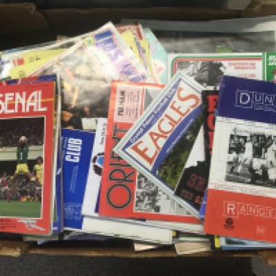 A box Containing football programs, books and magazines