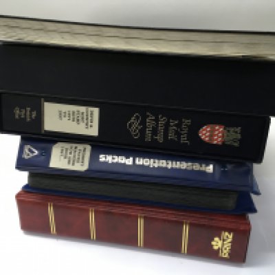 Six albums of mint great Britain postage stamps.