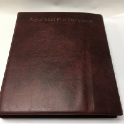 13 albums of great Britain presentation packs together with one plastic container.