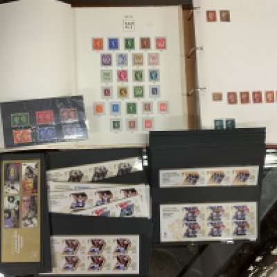 A varied collection of stamps, books, presentation packs and albums. (C)