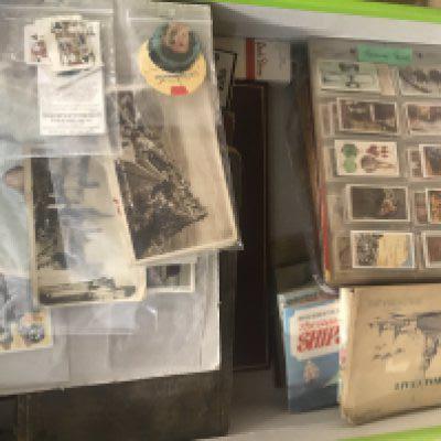 A box containing tea and cigarettes cards various.