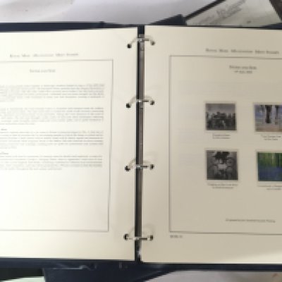 Four blue Royal Mail albums including Millennium album containing presentation packs and conforming first day covers and a few PHQ cards. (4)