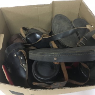 A box containing Vintage binoculars.