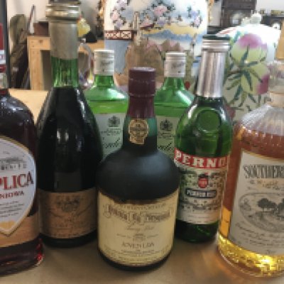 A collection of Alcohol to include Port, Pernod, Sothern Comfort and Gordon Gin