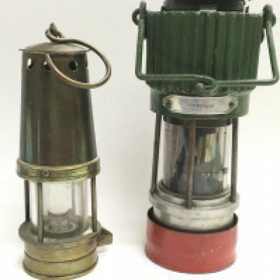 A Hailwoods lamp type A.D.C.M and a vintage miners lamp 18 & 21cm tall. This lot cannot be posted