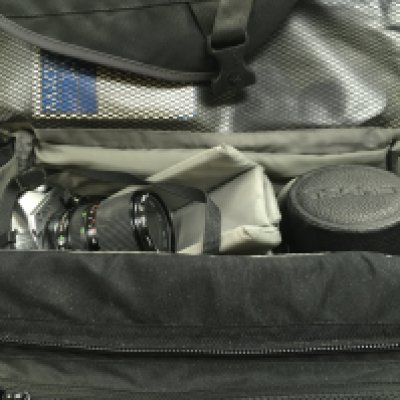 A Canon AT-1 camera and a collection of lenses including rmc tokina 100-300mm, Canon FD50mm, Vivitar 24mm, Tokina 24mm etc. Postage category C