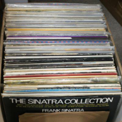 A box of Vinyl records including Frank Sinatra, Ella Fitzgerald etc